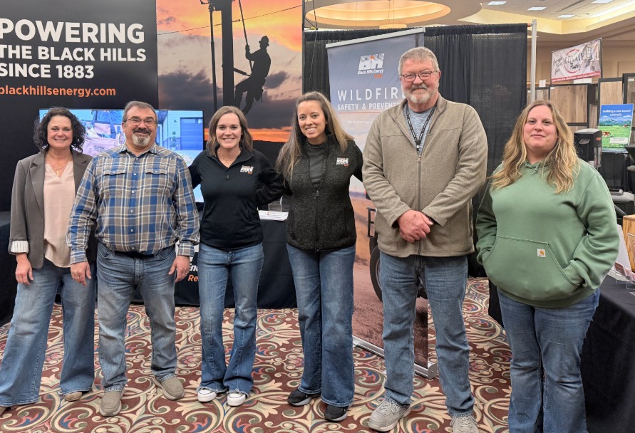Black Hills Energy employees posed in front of the home show booth in South Dakota